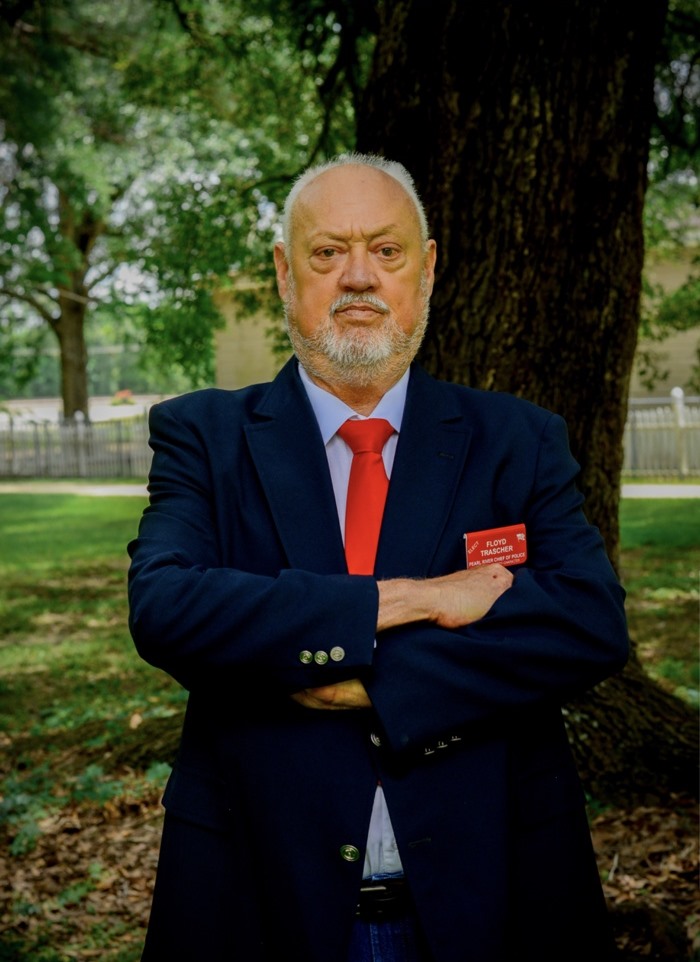 Floyd Trascher standing in a park with arms crossed